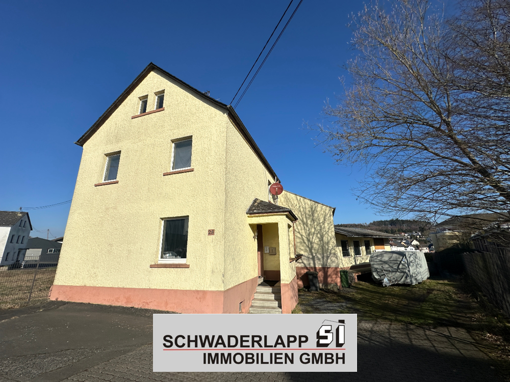 10994 - Vermietetes Einfamilienhaus mit Lagerfläche und Entwicklungspotenzial in Ransbach-Baumbach